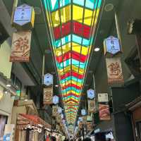 Colourful street market with many shops