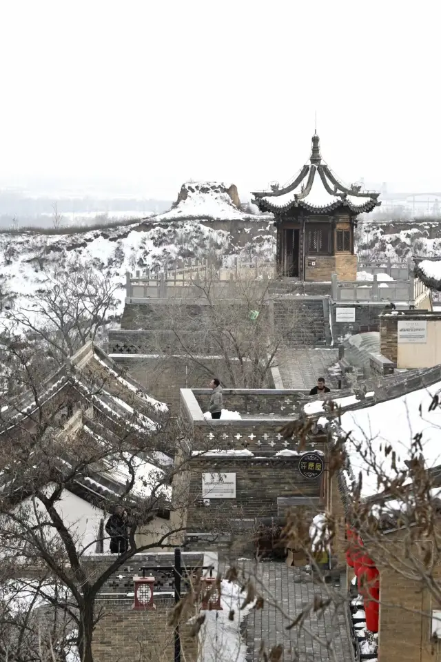 Treading through the snow in the ancient city of Xinzhou