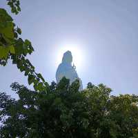 Peace and tranquility beside a giant Buddha.