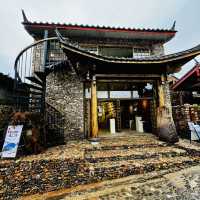 Quaint stone village under Yulong Mountains