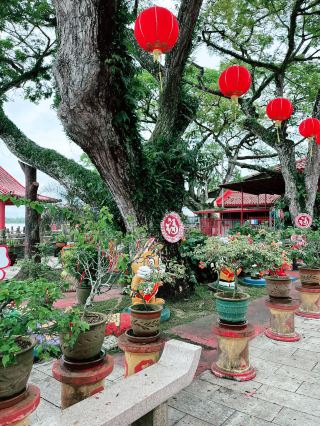 Scenic Floral Retreat with Cultural Sculptures
