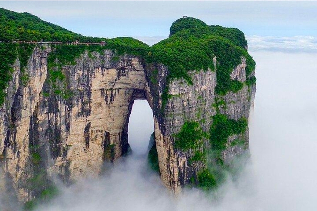 🏞️ Zhangjiajie, China — A Dreamland Floating Above the Clouds 🇨🇳✨

Have you ever imagined a place where towering mountains rise above the clouds, mist drifts between majestic stone pillars, and nature creates a landscape that seems almost unreal? Welcome to Zhangjiajie, one of China's most extraordinary natural wonders! 💚☁️

Located in Hunan Province, Zhangjiajie is famous for its dramatic sandstone peaks, lush forests, and breathtaking mountain scenery. The spectacular pillars of Zhangjiajie National Forest Park inspired the floating mountains in the movie Avatar, making this destination feel like stepping into another world.

One of the most incredible sights is Tianmen Mountain, home to the famous natural rock arch known as Heaven's Gate. The winding mountain road, scenic cable car, and glass walkways offer unforgettable views for adventurous travelers.

Whether you explore the misty mountain trails, admire the endless green valleys, or watch the clouds dance around the towering peaks, Zhangjiajie promises scenery that stays in your heart forever.

✨ Zhangjiajie is more than a destination—it's a magical meeting of mountains, clouds, and imagination.

If you could visit one place in China, would Zhangjiajie be on your bucket list? ❤️✈️

#Zhangjiajie  #ChinaTravel  #AvatarMountains  #HunanChina  #TianmenMountain  #NationalForestPark  #MountainViews  #NaturePhotography  #TravelMoments  #ExploreChina #travel2026 #naturalwonders #travel 