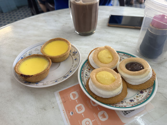 🍽️ “Where Tradition Meets Surprise: Dive into UFO Tarts & Authentic Hainanese Chicken”