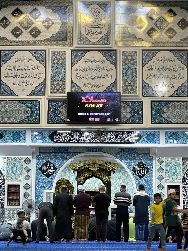 The mosque features intricate Islamic calligraphy 