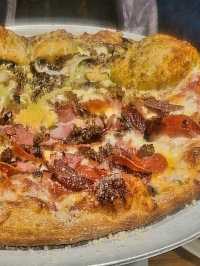 Enjoy colorful art, eclectic music and great hand tossed pizza at Mellow Mushroom