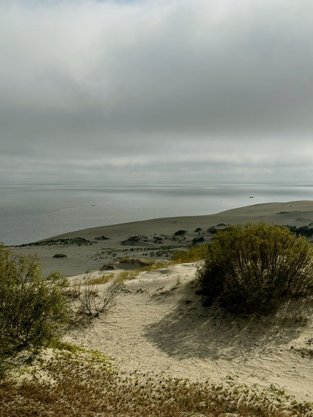 The Curonian Spit is a narrow sandy stretch of land between the Baltic Sea and the Curonian Lagoon