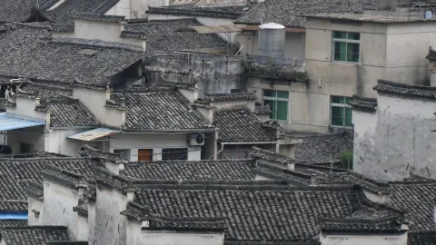 Huangshan: Overlooking Xidi Village. Layered Hui-style architecture, walking through an ink wash painting — traveler post in Yi County