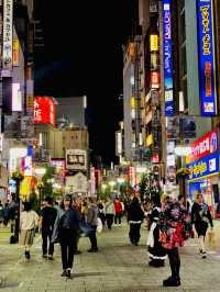 Godzilla and the bustling street of Shinjuku