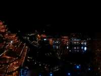 Buyi Village by Night – Where Firelight Meets Folklore Under a Starry Sky