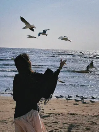 Awake next to the sea, drowning in gentle blue.