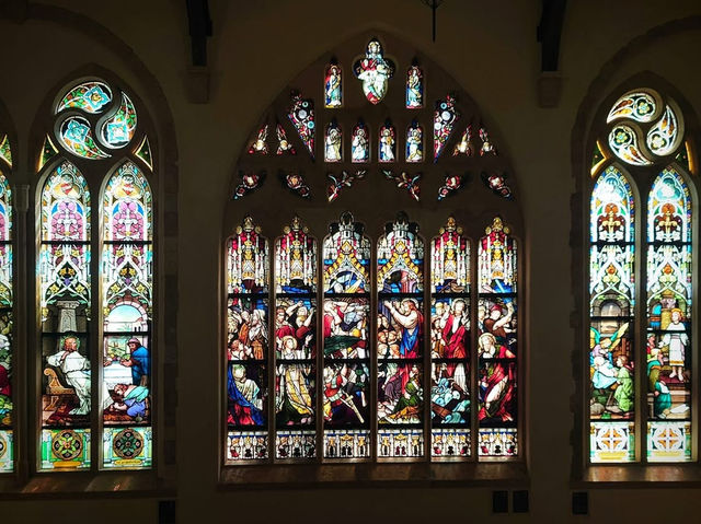 Bright stained glass and the beauty of the stone building