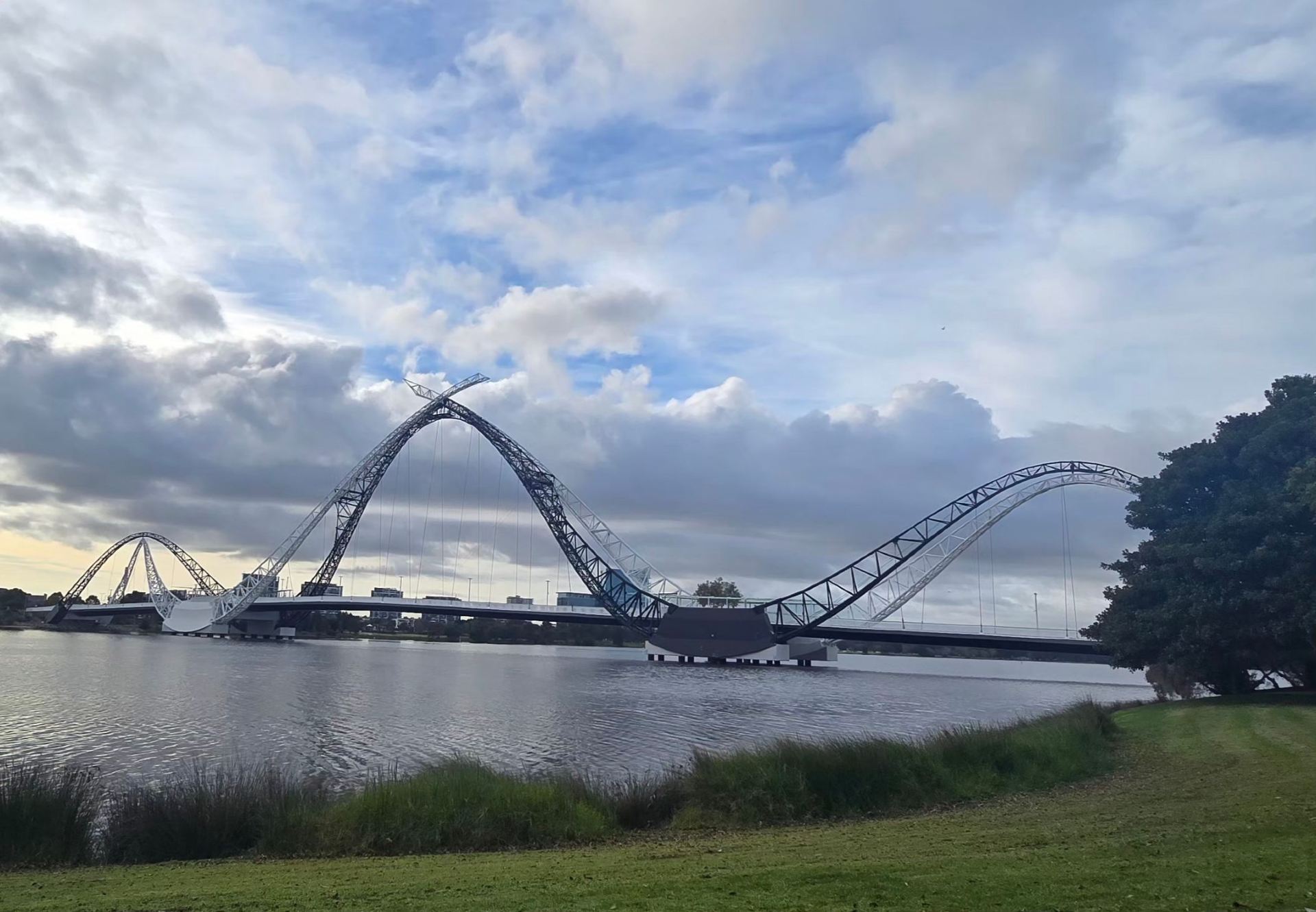 Gear Up for Urban Adventures in Burswood! 🏟️🌉  
Kick off your Burswood day trip with two of Perth’s most iconic modern attractions: Optus Stadium and Matagarup Bridge. Experience world-class architecture, riverside strolls, and unbeatable cityscape views—all in a laid-back Aussie vibe!

Start your morning at Optus Stadium (333 Victoria Park Dr), home to epic AFL games and jaw-dropping concerts. Even if there’s no event, the behind-the-scenes tour is a must—check out the locker rooms and snap an “I’m the MVP” photo on the field. Don’t forget your camera: the stadium’s sleek design pops against that sunny Western Australian sky. ⚡ Top tip: Stadium tours run Monday to Friday, 9 am–5 pm; plan accordingly, as it’s closed weekends.

Next, take the short stroll to Matagarup Bridge. This eye-catching pedestrian bridge isn’t just about crossing the Swan River—it’s about stopping mid-span for panoramic shots of the Perth skyline and riverside parks. For thrill-seekers, look out for the bridge climb or zip-line experiences (extra ticket required, weather dependent). 🌉 Insta-gold: The sweeping arches frame sunrise and sunset perfectly, especially if you get creative with low angles!

📝 Handy Tips:  
· Hydrate and slip, slop, slap—Perth sun is intense!  
· Book stadium tours in advance, especially during peak seasons.  
· Matagarup Bridge is open all day, so easy to fit into your plans.  
· Both sites are stroller and wheelchair friendly.

#burswood  #optusstadium  #matagarupbridge  #perthviews  #travelaustralia 