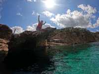 Paddleboarding and cliff jumping at secret caves in Ibiza