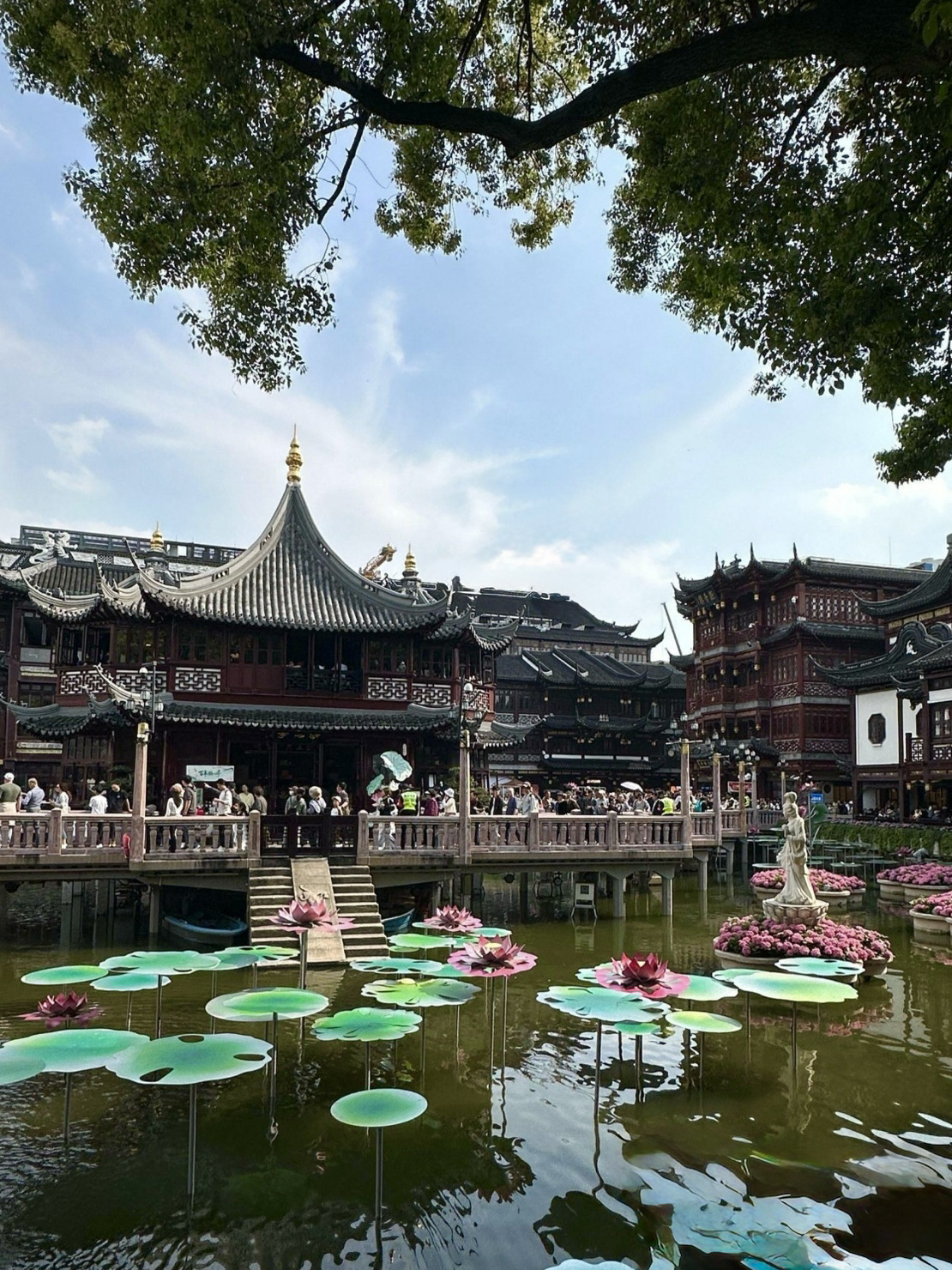 Shanghai's Yu Garden (豫园): Everything you need to know before you go

Yu Garden

If there’s one place in Shanghai that lets you escape the skyscrapers for a few hours and step back into Ming Dynasty China, it’s Yuyuan. Founded in 1559, it’s considered one of China’s most stunning classical gardens. Tucked away in the heart of the bustling metropolis, it offers a world of its own: koi ponds, rockeries, ornate pavilions, bridges, and the iconic dragon walls. 

Is it worth visiting?

Absolutely, especially if it’s your first time in Shanghai.

A common misconception is that Yuyuan refers to the entire Old City area. In reality, the garden and the surrounding bazaar are two different things. The garden itself requires a ticket and closes in the evening, whereas the surrounding shopping district is free to enter. 

⸻

What to See Inside

🐉 Dragon Walls

One of the garden’s signature features. These winding walls, topped with dragon sculptures, divide the space into various picturesque sections. 

🪨 Great Rockery

The largest surviving rock formation from the Ming Dynasty in the Jiangnan region. Climb to the top for a great view of the grounds. 

🏮 Pavilions and Ponds

The real magic of Yuyuan isn’t just one specific spot, but the shifting scenery. Every gateway, bridge, or window frame reveals a new, perfectly composed view. 

⸻

Pro Tips

✅ Arrive right at opening.

Tour groups start flooding in after 11:00 AM.

✅ Budget 1.5–2 hours for the garden.

Most people rush through in 30 minutes and leave feeling underwhelmed. Take your time.

✅ Stay for the Chenghuangmiao area after dark.

In the evening, the red lanterns, pavilions, and bridges look even more spectacular than the garden itself. 

✅ Don’t come just for the shopping.

The real value here is the atmosphere of Old Shanghai, not the souvenir stalls.

⸻

The Perfect Itinerary

📍 Yuyuan Garden →
📍 City God Temple →
📍 Nine-Turn Bridge →
📍 Old Town →
📍 Evening lights at Chenghuangmiao

You can easily spend half a day on this route. 

📸 Photo Tip: The most stunning shots aren’t actually inside the garden. Head to the Nine-Turn Bridge at night, where traditional pavilions and hundreds of lanterns reflect beautifully in the water.