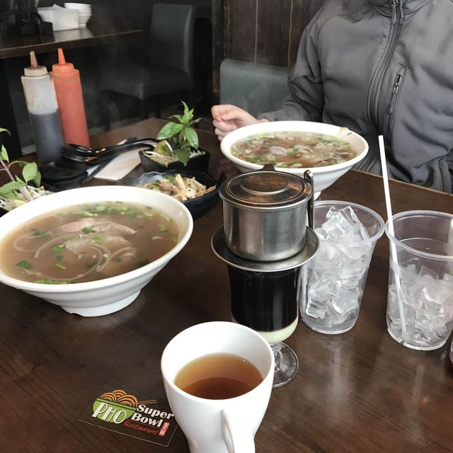 Hot pho (Vietnamese noodles soup) in a cold snowy day