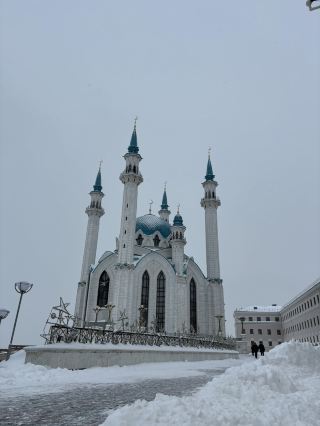 Step into Kul Sharif Mosque for a spellbinding blend of grandeur and serenity – the iconic heart of Kazan that dazzles with intricate Western-inspired architecture and vibrant cultural vibes.🌨️🏰

Start your visit at the main entrance, snapping a wide shot of the mosque's soaring minarets framed against dramatic clouds (perfect for those moody, insta-worthy moments!). Once inside, discover breathtaking domes, elegant marble, and colorful stained glass – every corner offers a new photo angle. Don’t miss the central prayer hall: it’s open to all, and even non-Muslim visitors are welcome. Admission is completely free, so take your time exploring each detail and soaking up the peaceful atmosphere.

For your tour: arrive early for fewer crowds, especially on rainy days when the mosque's illuminated interiors make for striking indoor photos. Look for unique views from the balcony and close-ups of the architectural flourishes. The mosque is open daily from 09:00–18:00 (last admission 17:30), and the address is Ulitsa Sheynkmana, Kazan, Respublika Tatarstan, Russia, 420014.

Tip: Dress respectfully (cover shoulders and knees); scarves are available at the entrance if needed. Be mindful of ongoing prayers and stick to designated visitor sections. The mosque is just as stunning in winter, with icy surroundings and a cozy indoor vibe, ideal for cultural lovers and architecture buffs alike.

#Kazan #KulSharifMosque #Architecture #CulturalTravel #Russia