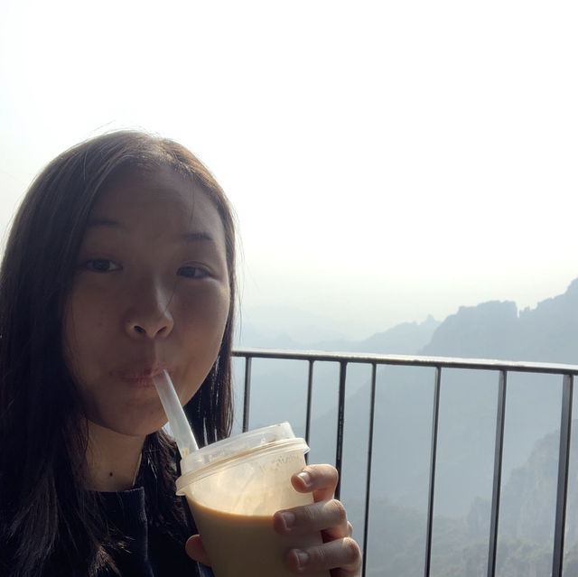 Drinking iced latte on top of Baishi Mountain