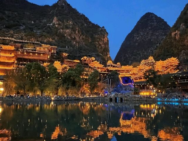 Buyi Village by Night – Where Firelight Meets Folklore Under a Starry Sky