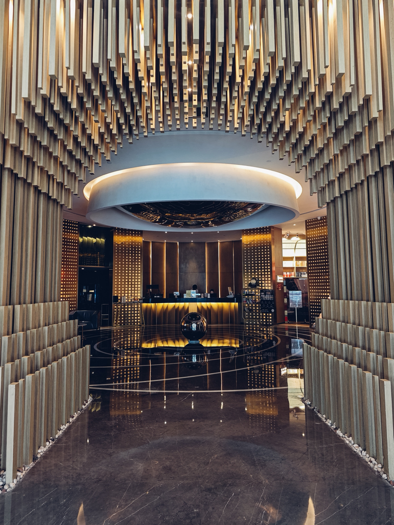 We booked the Zhonghao S Hotel via Trip.com this time. Overall, we were pretty satisfied with our stay, but there are a few things I'd like to share:
🏢 Exterior & Lobby: The hotel's exterior looks a bit dated. Also, it would be perfect if the check-in process at the lobby could be a little faster.
🛏️ Room Vibe & Midnight Snacks: The room was much better than expected! I loved that the bathroom had separate wet and dry areas. The shower amenities were fully stocked, and there was plenty of room for our luggage. A special shoutout to the bay window area—it comes with soft cushions, making it a super cozy spot to sit, eat midnight snacks, and chat at night! The best part? When you order late-night food delivery, the hotel's robot brings it right to your door. You don't have to go down to the lobby to grab it yourself. This was such a thoughtful touch and a huge plus!
Also, we purposely chose a room with "non-opening windows" because online reviews mentioned that the rooms with opening windows face the street and can get quite noisy in the mornings and evenings. I'm easily bothered by traffic noise, so I didn't mind the sealed windows at all. It turned out the room was actually quite quiet.
⚠️ Minor Room Drawbacks: My husband and son felt the mattress was way too soft and lacked support, leaving them a bit sore and tired after waking up.
Additionally, it would be a nice touch if they could add a mirror to the desk to make it easier for ladies to do their makeup.
🍽️ Breakfast & Facilities: The breakfast spot in the morning was fantastic, the environment was decent, and the food quality and taste were acceptable.
However, my son was a bit disappointed to find out that the hotel doesn't have a gym for working out.
Conclusion: Despite a few minor flaws, the overall stay was still great with high value for money. I highly recommend it, especially if you're a fan of ordering late-night food delivery!
  Recommended