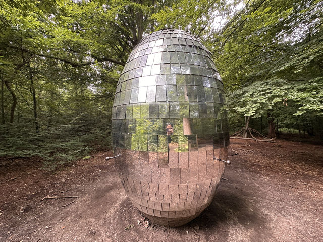 Art sculptures lost in a forest
