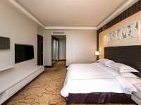 "The Promenade Hotel-Where City Convenience Meets Cozy Comfort"