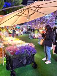 PURPLE FLOWERS AND GLOWING LIGHTS IN SHUNCHENG SHOPPING MALL