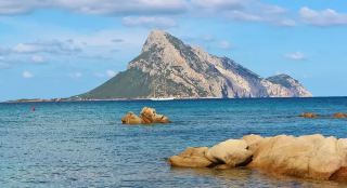 Sardinia's Emerald Coast, with its rippling azure waves and snow-white sands