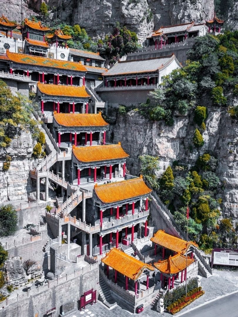 An ancient temple mountain built into the cliffs, like a “9-story demon tower” from a video game.