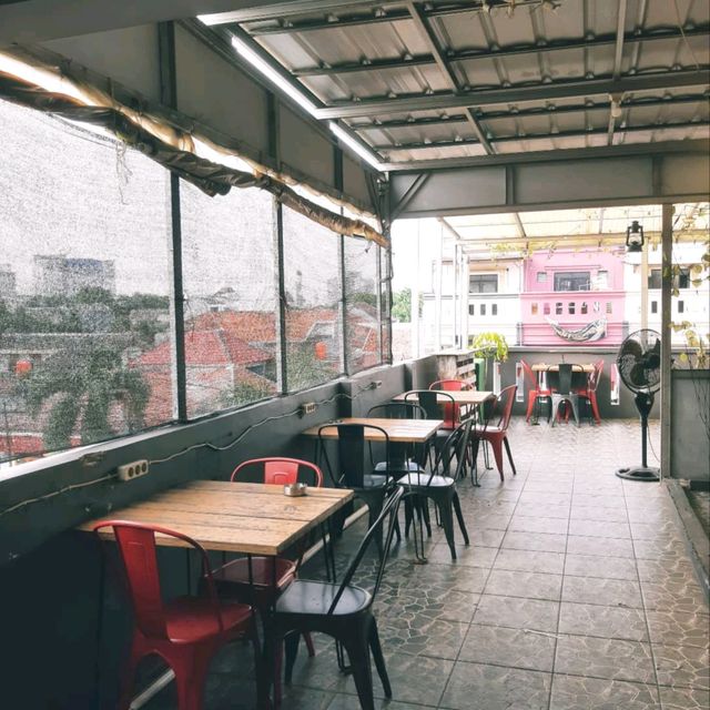 THIS PLACE HAS A ROOFTOP AND A ROASTERY ON THE SECOND FLOOR