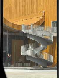 Stylish curvy Chinese museum about canal