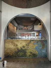 Stylish curvy Chinese museum about canal