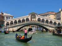 Rialto Bridge in Venice by land and boat