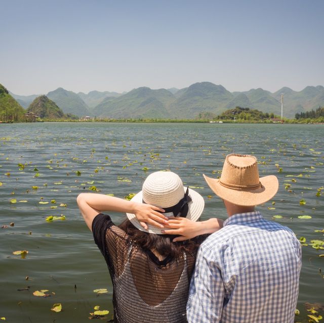 Puzhehei's Tranquil Waters & Lotus Blooms