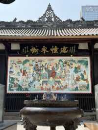 Serene temple next to busy Taikoo Li