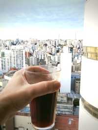 Try home made breakfast on top floor of iconic vintage building of copan with Sao Paulo skyline view