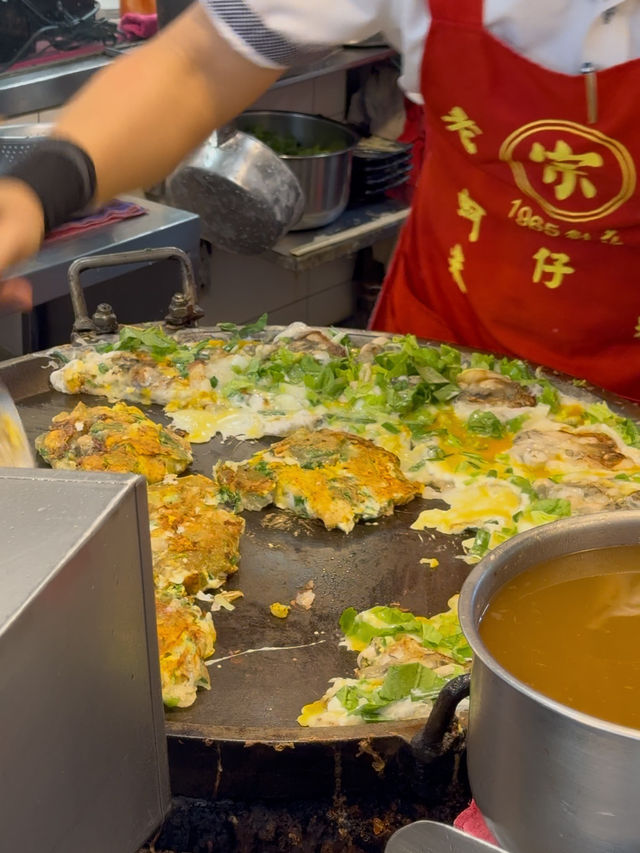Oyster Egg Omelette on Conveyor Belt: Michelin Dish at Ningxia Night Market