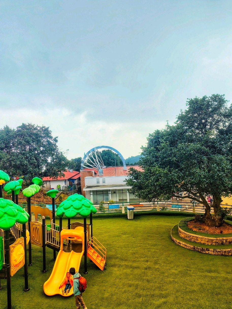 🎢 A Thrilling Escape at Chandragiri Amusement Park
Just a short trip from Kathmandu, Chandragiri Amusement Park offers a perfect blend of excitement, nature, and breathtaking views. The journey begins with the iconic Chandragiri Cable Car, lifting you above dense green forests and giving you a stunning aerial view as you ascend the hill.
At the top, the atmosphere instantly feels refreshing and peaceful. The amusement park features fun rides and open spaces, making it a great place for families, couples, and friends. Whether you’re enjoying light thrills or simply walking around, the cool breeze and scenic surroundings make every moment enjoyable.