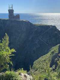 A beautiful lighthouse on a cliff