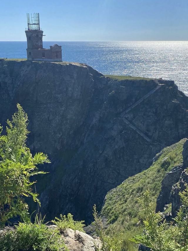 A beautiful lighthouse on a cliff