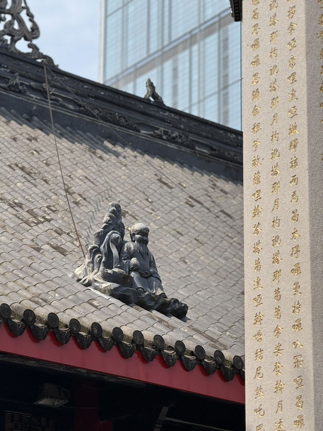 Serene temple next to busy Taikoo Li