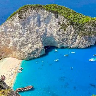 Reach the top of the spectacular view! The miraculous blue waters seen from Navagio Beach Observation Deck
