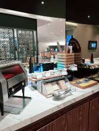 “Golden Lounge Satellite: Luxury Above the Clouds at KLIA”