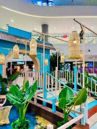 “Quill Mall Glows in Blue: A Radiant Hari Raya Celebration”