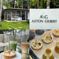 🌿 Aston Gilbert Café – คาเฟ่กระจกล่องหนกลางสวนยาง