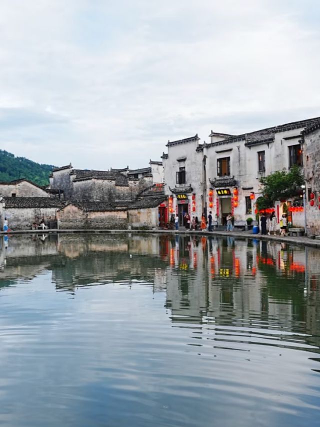Crescent Reflections: A Journey Through Hongcun’s Timeless Mirror