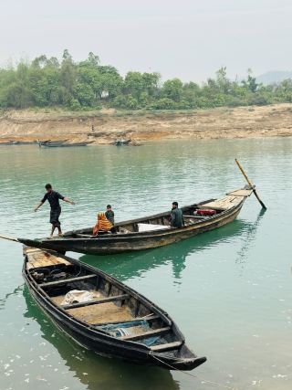 💙🏔️ Lalakhal — The Blue-Green Paradise of Sylhet 🌿🇧🇩

If you are looking for a peaceful destination surrounded by beautiful hills, crystal-clear water, greenery, and breathtaking landscapes, then Lalakhal should definitely be on your Sylhet travel list.

Located in Jaintiapur Upazila of Sylhet District, Lalakhal is famous for its stunning blue-green river water and the hills that surround it. The natural beauty of this place makes it one of the most picturesque destinations in Bangladesh.

🌊 The Magical Blue-Green Water

The most fascinating feature of Lalakhal is its water. Depending on the season, weather, and water conditions, the river can appear in beautiful shades of blue, turquoise, and green.

When sunlight falls on the water, the scenery becomes even more beautiful. The clear water, colorful riverbed, and surrounding greenery create a postcard-like view. 💙✨

🚤 Boat Ride on Lalakhal River

A boat ride is the best way to experience Lalakhal.

As the boat moves slowly along the river, you can enjoy the surrounding hills, greenery, flowing water, and peaceful atmosphere. The journey is relaxing and offers countless opportunities for beautiful photographs.

For many visitors, the boat journey itself becomes one of the highlights of the trip. 🚤📸

🏔️ Surrounded by Hills

Lalakhal is surrounded by beautiful hills, including the distant hills of the Meghalaya region. The combination of hills and river creates a spectacular natural landscape.

On a clear day, the mountains look especially beautiful against the blue sky. If there are clouds floating over the hills, the scenery becomes even more dramatic.

🌿 Peaceful Natural Environment

One of the best things about Lalakhal is its peaceful atmosphere. Away from the noise of the city, you can simply sit beside the river, enjoy the fresh air, listen to the sound of water, and admire the surrounding greenery.

It is an ideal destination for people who want to relax and spend quality time in nature.

📸 A Dream Destination for Photographers

Lalakhal offers plenty of opportunities for travel photography.

You can capture:
· 💙 Blue-green river water
· 🏔️ Mountain landscapes
· 🚤 Traditional boats
· 🌿 Green forests and hills
· ☁️ Clouds over the mountains
· 🌅 Beautiful river views
· 🛶 Local life along the river

Early morning and late afternoon can provide beautiful natural light for photography.

☕ Enjoying Tea by the River

After the boat ride, relaxing beside the river with a cup of hot tea can be a wonderful experience. The peaceful environment, fresh air, and beautiful scenery make even a simple cup of tea feel special.

🌧️ Best Time to Visit Lalakhal

Lalakhal can be visited throughout the year, but the scenery changes with the seasons.

🌧️ Monsoon: The surrounding landscape becomes lush and green, although water color and river conditions can change because of rainfall.

🍃 Winter: Often offers comfortable weather for sightseeing and boat rides.

☀️ Dry Season: The water may appear clearer in favorable conditions, making it a popular time for photography and boat trips.

🚗 How to Get There

From Sylhet city, you can travel toward Jaintiapur and Sarighat, from where you can arrange a boat ride toward Lalakhal.

You can travel by CNG, private car, or reserved vehicle. If you are traveling with family or friends, a reserved vehicle can be more convenient.

🚤 Boat Ride & Local Costs

The total cost depends on the boat type, duration, number of people, and transportation. If you are traveling in a group, sharing the boat and vehicle costs can make the trip more affordable.

Since local fares can change depending on season and demand, it is best to confirm the current boat and transport rates before your trip.

📍 Lalakhal, Jaintiapur, Sylhet, Bangladesh

#Lalakhal #LalakhalSylhet #Sylhet #SylhetTour #SylhetTravel #Jaintiapur #LalakhalRiver #ExploreBangladesh #BlueWater #MountainViews #TravelPhotography #BeautifulBangladesh #TravelDiaries