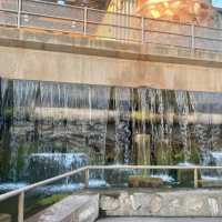 waterfall in the middle of the road 