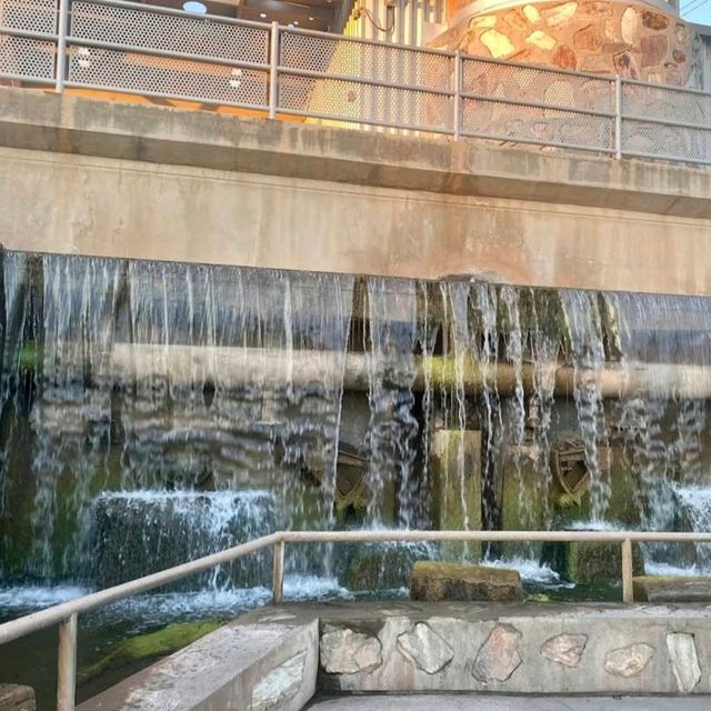 waterfall in the middle of the road 
