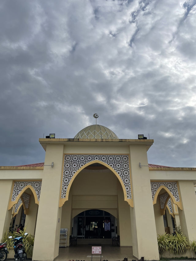 The mosque features intricate Islamic calligraphy 