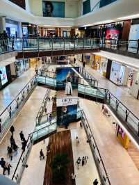 “The Gardens Mall: A Modern Harmony of Glass, Wood, and Elegance”